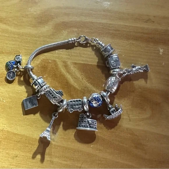 authentic Pandora Travelers charm bracelet. It’s a must have if u travel a-lot. - Picture 7 of 9